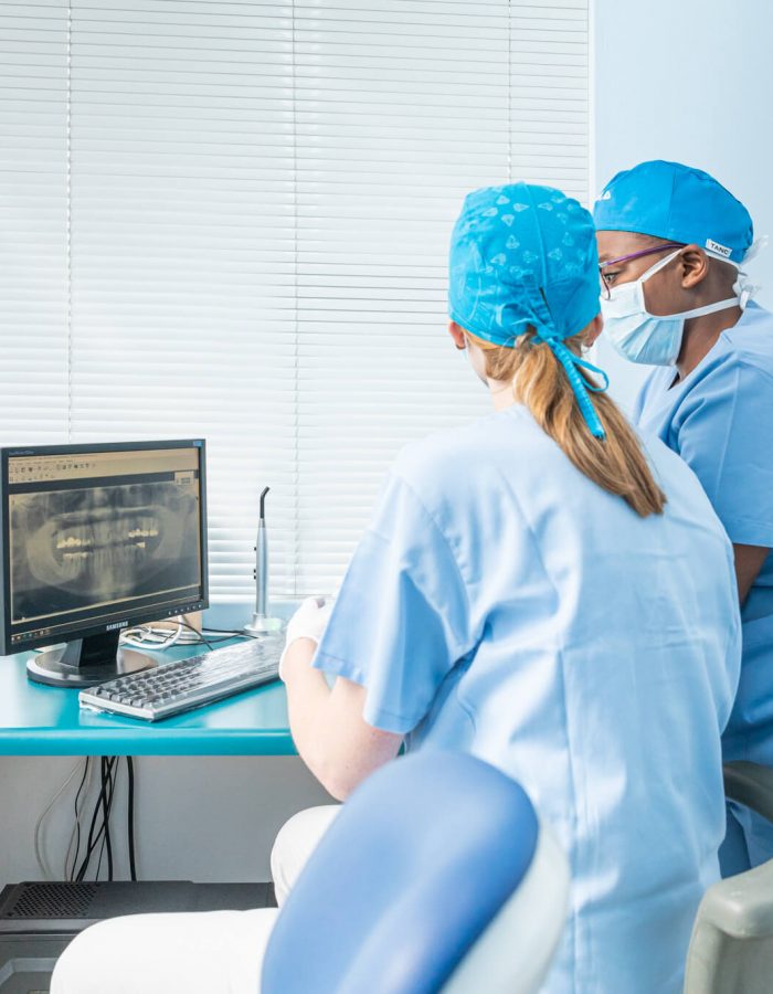 Dentists diagnosing a patient
