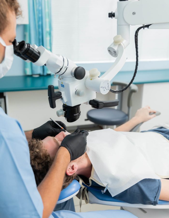 Dentist using a Zumax scope