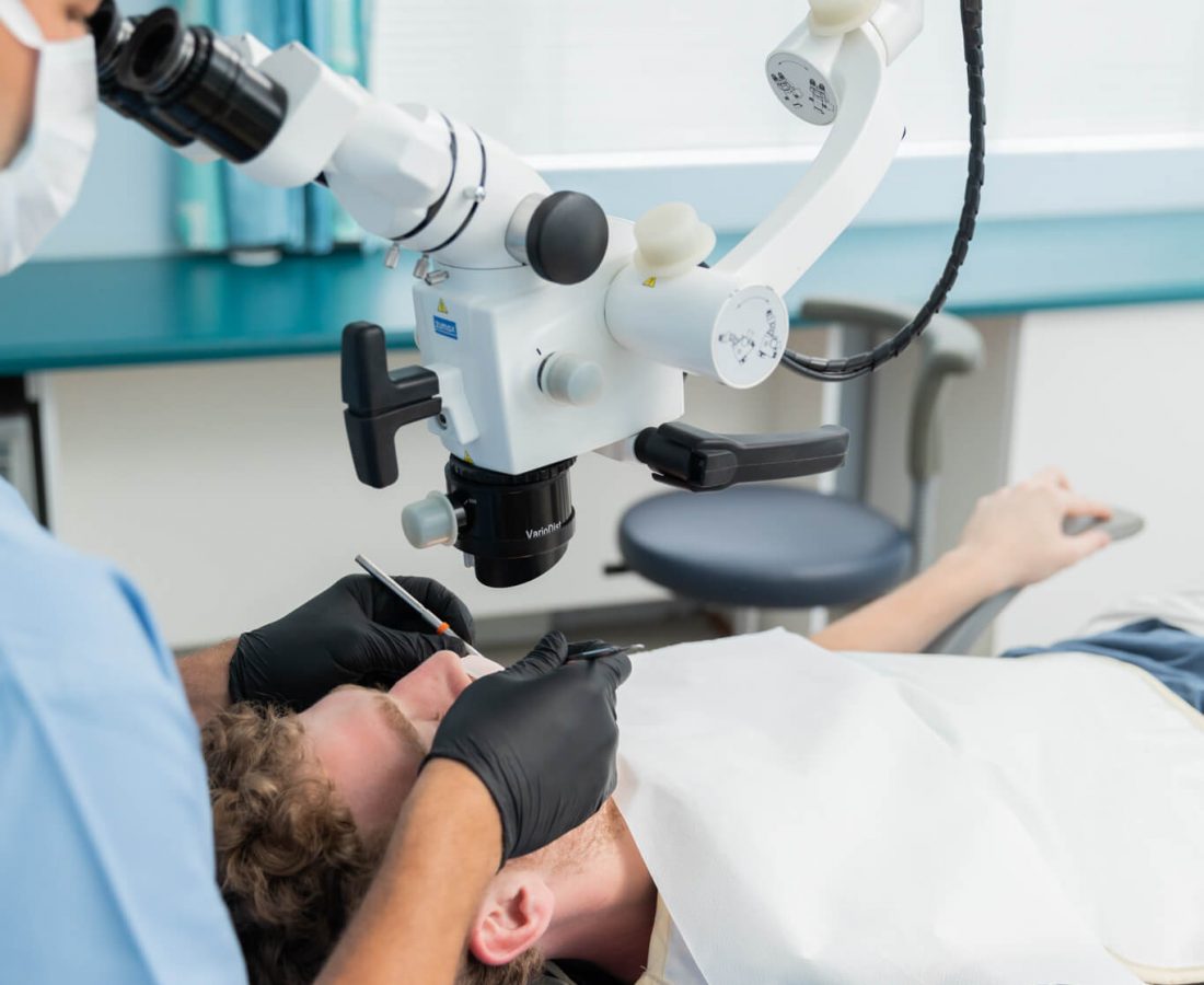 Dentist using a Zumax scope